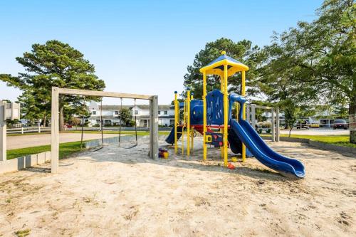 a playground with a slide in a park at Mallard Lakes --- 38082 Mockingbird Ln Unit #48 in Selbyville