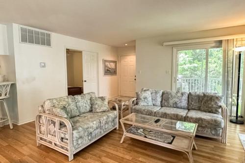 a living room with a couch and a coffee table at Sea Colony --- 55032 Pine Lake Dr in Bethany Beach