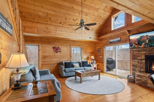 a living room with a couch and a table at Little Elk Lodge in Elk Park