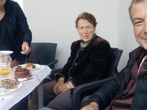 a man and a woman sitting at a table with a plate of food at Tepelen Albania in Tepelenë