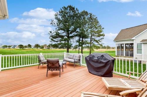 a deck with chairs and chairs on a house at Bear Trap Dunes - 53 October Glory Ave in Ocean View