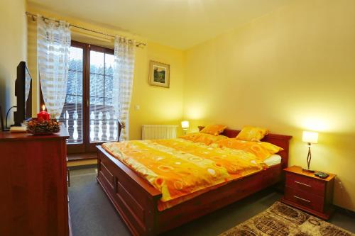 En eller flere senge i et værelse på Penzion Veronika