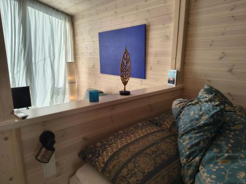 a bedroom with a window and a bed with a pillow at Tiny House Am Guckenberg in Diez in Diez