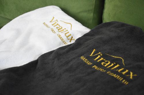 a tshirt with the words happy new year and a pillow at Virajlux in Dâmbovicioara