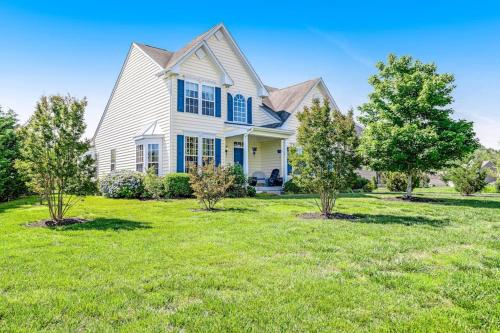a large white house with trees in the yard at Bayview Landing - 38013 Bayview Circle in Selbyville