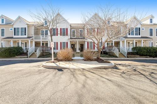 a street in front of some houses with trees at Bear Trap Dunes - 60F October Glory in Ocean View