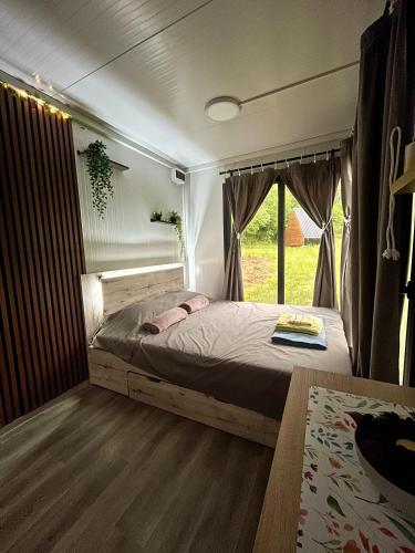 a bedroom with a bed in a tent at OffGrid Retreat Rtanj in Boljevac