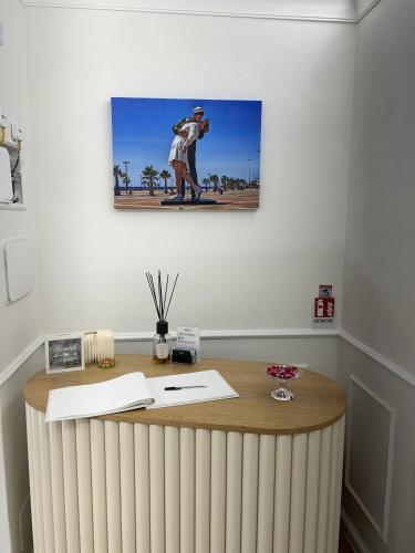 an office with a desk with a picture of a man at Emy Suites in Civitavecchia