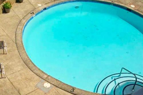 an overhead view of a large blue swimming pool at Rehoboth Beach -- The Crest #303 in Rehoboth Beach