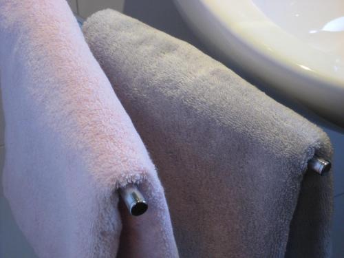 two towels on a towel rack next to a sink at Ferienwohnung-VS in Villingen-Schwenningen