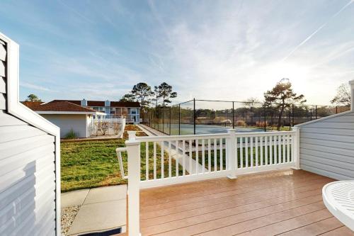 a balcony with a white railing and a fence at Hidden Harbour -- 306 Ocean View Parkway in Bethany Beach
