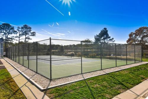 a tennis court with a net on top of it at Hidden Harbour -- 306 Ocean View Parkway in Bethany Beach