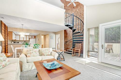 a living room with a couch and a table at Sea Colony - 802 Wimbledon in Bethany Beach