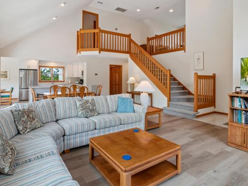 a living room with a couch and a table at 4160 - Shipley in Kitty Hawk