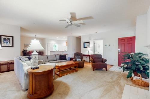 a living room with a couch and a table at Bear Trap Dunes - 112A Willow Oak Ave in Ocean View