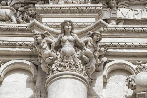 a statue of a woman on the side of a building at Buon Consiglio B&B in Lecce