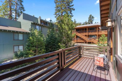 a deck with a wooden fence in front of a house at 4BR Townhome Near Canyon Lodge & Lakes Basin in Mammoth Lakes