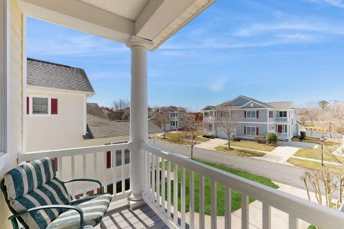 a porch with two chairs and a view of a street at Bayside Resort - 36295 Sunflower in Selbyville