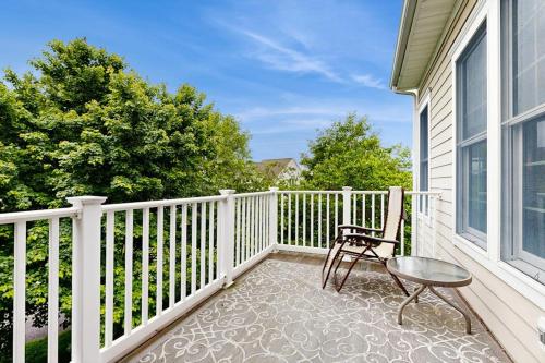 a patio with a chair and a table on a balcony at Bear Trap Dunes - 1D Clubhouse in Ocean View