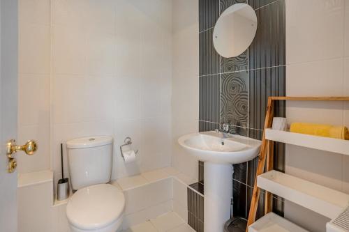 a small bathroom with a toilet and a sink at 3 Bed in Mumbles oc-m33090 in The Mumbles