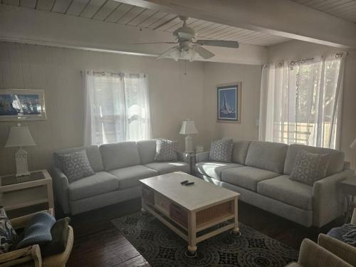 a living room with a couch and a coffee table at Bethany West - 609 Brookview in Bethany Beach