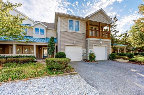 a large house with a driveway in front of it at Sea Colony - 56032 Great Pine in Bethany Beach