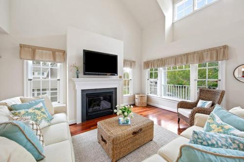 a living room with a fireplace and a tv at Bethany West -- 719 Fenwood in Bethany Beach
