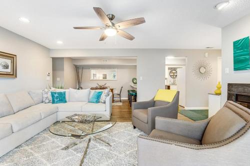 a living room with a white couch and a ceiling fan at Eagles Landing I --- 260 Sea Eagle Dr Unit 7 in Rehoboth Beach