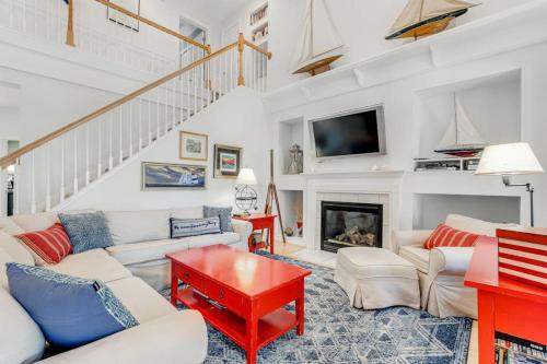 a living room with a couch and a fireplace at Bear Trap Dunes - 60 Willow Oak in Ocean View