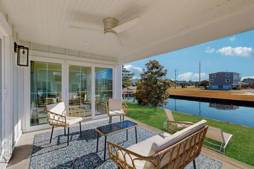 a porch with chairs and a view of the water at South Bethany --- 102 Brandywine Dr in Bethany Beach