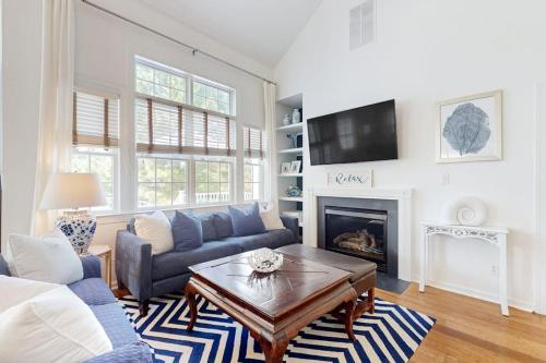 a living room with a couch and a coffee table at Bear Trap Dunes --- 34 Sycamore Street in Ocean View
