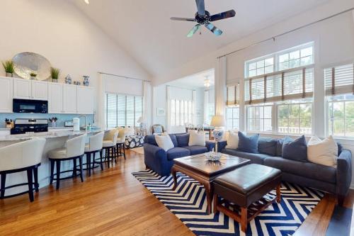 a living room with a couch and a table at Bear Trap Dunes --- 34 Sycamore Street in Ocean View