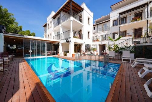 a swimming pool in front of a building at The Lume Boutique Hotel & Restaurant & Spa in Bodrum City