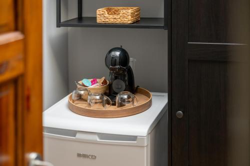 a coffee maker on top of a washing machine at Penzion, restaurant Gloria in Chrastava