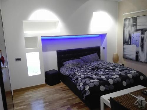 Ένα ή περισσότερα κρεβάτια σε δωμάτιο στο B&B Stazione Latina