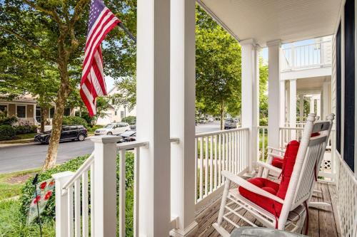 two chairs on a porch with an american flag at Bear Trap Dunes 16 Sycamore St in Ocean View