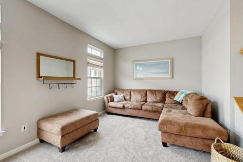 a living room with a couch and two ottoman at South Hampton --- 38118 E Chester Ln in Ocean View