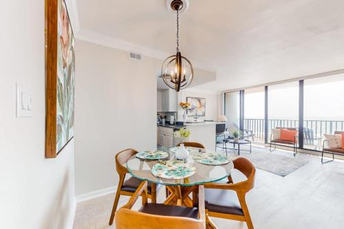 a dining room with a table and chairs and a kitchen at Sea Colony - 708 Brandywine House in Bethany Beach
