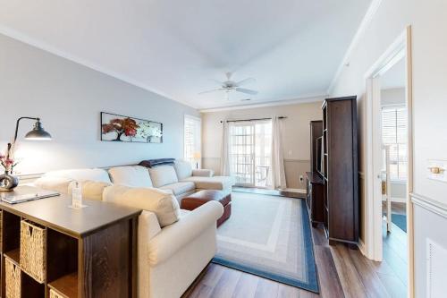 a living room with a couch and a table at The Tides -- 20007 Sandy Bottom # 4202 in Rehoboth Beach