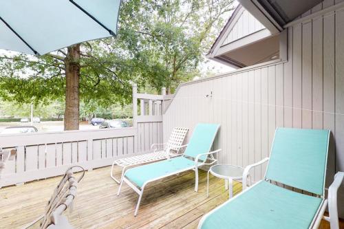 a porch with chairs and tables and a window at Sea Colony - 9603 Timberlake in Bethany Beach