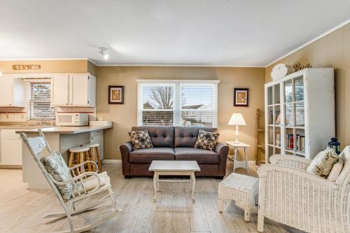 a living room with a couch and a table at Bethany Meadows - 2A Briar North in Frankford