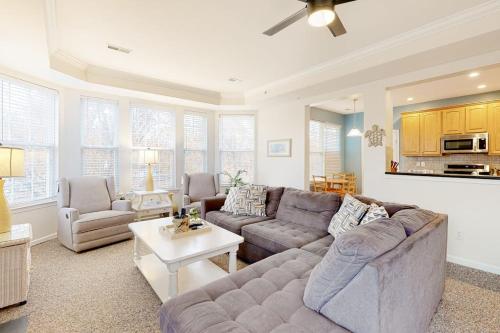 a living room with a couch and a table at Bayside Bethany Lakes N Mill #114 in Ocean View