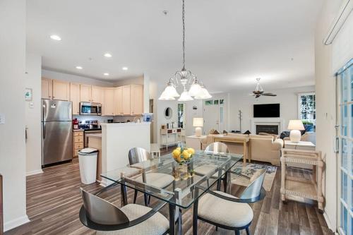 a kitchen and living room with a glass table and chairs at Bear Trap Dunes --- 45A Willow Oak in Ocean View