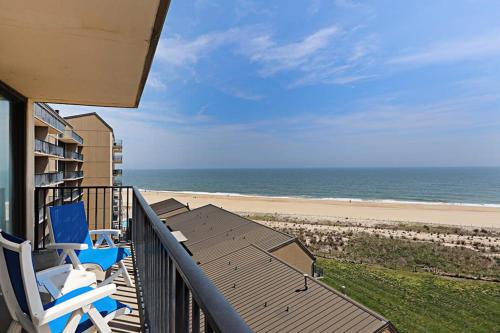 a balcony with chairs and a view of the beach at Sea Colony - 709 Brandywine House Rd in Bethany Beach