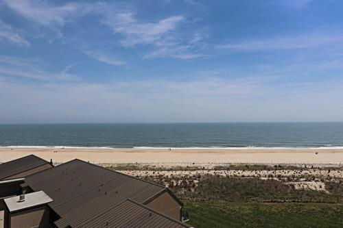 a view of a beach with a house and the ocean at Sea Colony - 709 Brandywine House Rd in Bethany Beach