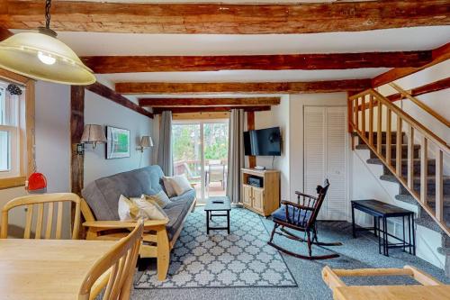 a living room with a couch and a table at Running Fox Farm in Baraboo