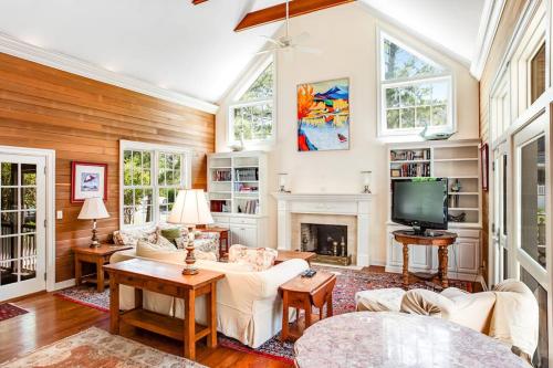 a living room with white furniture and a fireplace at Rehoboth Beach --- 6 Holly Road in Rehoboth Beach