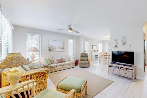 a living room with a couch and a tv at Bethany Pines --- 428 Bethany Pines in Bethany Beach