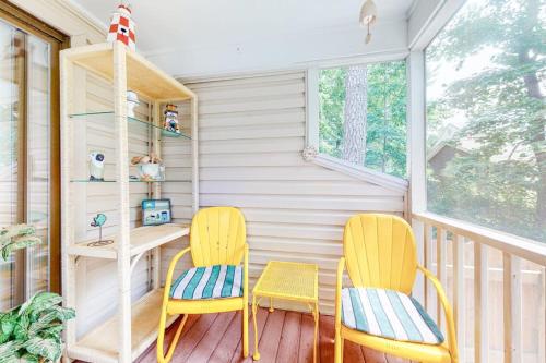 two chairs and a desk on a porch at Bethany Pines --- 428 Bethany Pines in Bethany Beach
