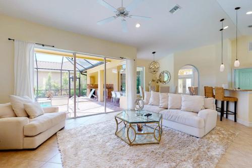a living room with two white couches and a table at Villa Katrin in Naples